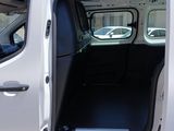 a white van with the door open and the driver ' s seat down