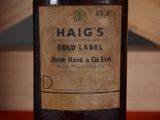 a close up of a bottle of wine on a table