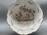 a plate with a picture of a man and a dog on it