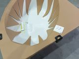 a cardboard table with a paper cut out of it