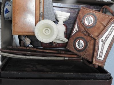 a suitcase full of stuff that is sitting on top of a table