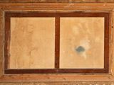 a picture of a window in a building that has been boarded