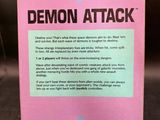 a close up of a box of demon attack on a table