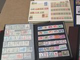 a lot of stamps on a table with a book