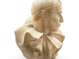 marble bust of a man with a cap and a collar