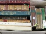 a box full of books sitting on a table