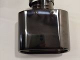 a black flask with a metal top on a white table