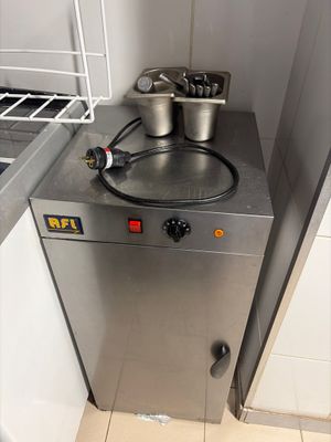 a small kitchen with a stove and a sink in it