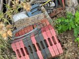 a pile of wood next to a pile of firewood