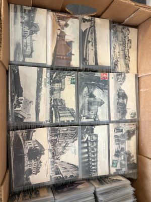 a cardboard box full of old photos of a train
