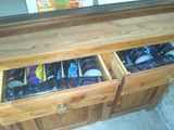 two drawers that have a lot of items inside of them