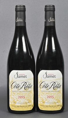 two bottles of wine sitting next to each other on a table