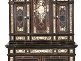 a cabinet that has a clock on top of it