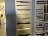 a wall with a bunch of knives hanging on it