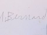a close up of a handwriting on a white wall