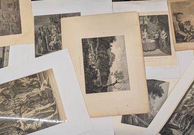 a lot of old pictures on the table together