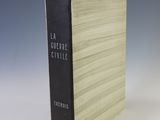 the book is sitting on a white surface with a blue background