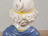 a close up of a ceramic figurine of a man with a beard