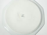 a picture of a white plate on a white table