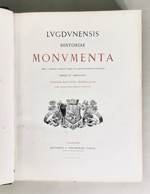 an open book with a picture of a coat of arms on it