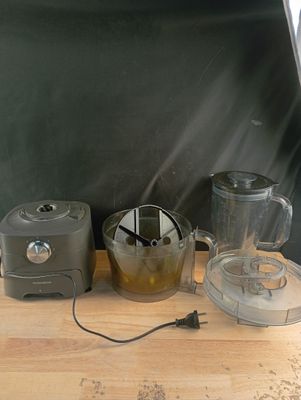 a blender and a blender sitting on a wooden table