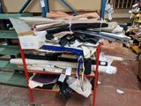a pile of assorted items on a red cart