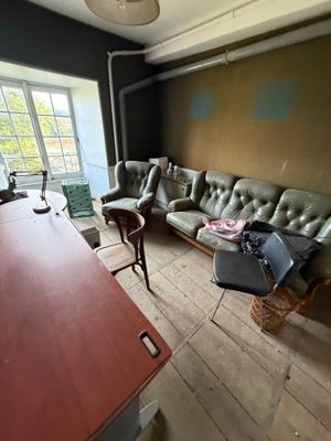 an image of a living room with a couch and a table