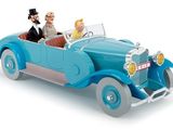 a blue toy car with a man and a woman in it