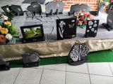 a table that has a bunch of laptops and other items on it