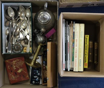 a box full of silverware and other silverware items