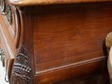 a wooden table with a mirror on top of it