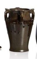 three vases sitting next to each other on a white surface