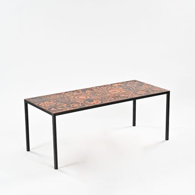 the table is made of wood and has a metal frame