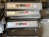 three rolls of rotomax are stacked on top of each other in a warehouse