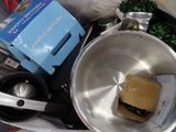 a pan with a sandwich inside of it next to other items