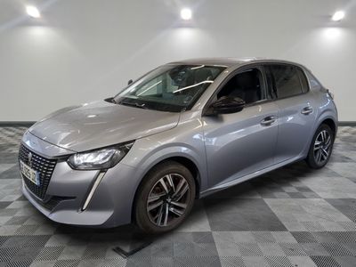 the silver car is parked on a checkered floor in a garage
