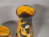 two vases sitting next to each other on a table