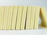 several pieces of yellow paper stacked on top of each other