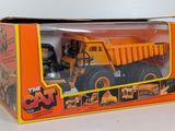 a box with a toy truck in it on a table