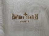 a close up of a white shirt with a logo on it