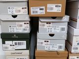 several boxes of different sizes and colors are stacked on top of each other