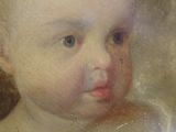 portrait of a baby in a white dress in a frame
