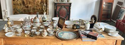 a wooden table with a lot of items on top of it