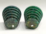two pieces of green marble are stacked on top of each other