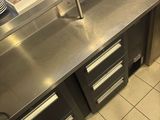 stainless steel counter top in a commercial kitchen with stainless steel cabinets