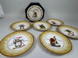 six assiettes à bords dorés et une horloge sur une table