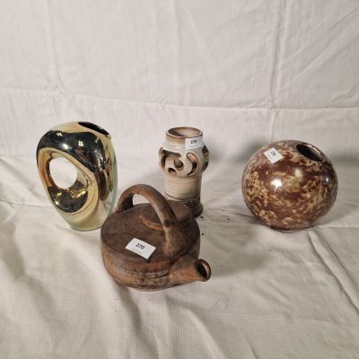 three vases that are sitting on a white surface