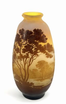 a vase that has a picture of a tree on it