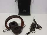 the jvc headphones are sitting on the table next to a bag