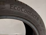 a close up of a tire on a white surface